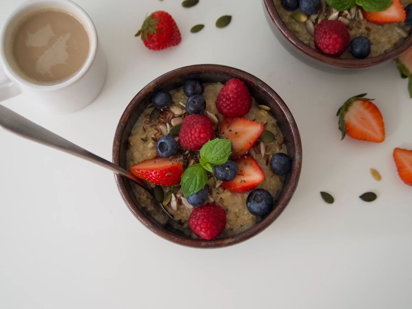 Oatmeal topped with fresh berries, photographed from above